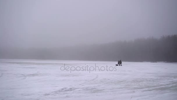 Unrecognizable people walking on frozen lake — Stock Footage Unrecognizable people walking on frozen lake Video Clip