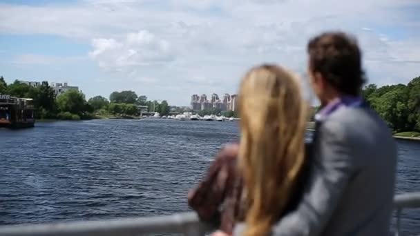 Young couple embracing on a bridge — Videoclip de stoc