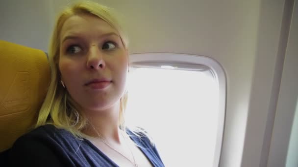 Young woman in airplane — Stock Video