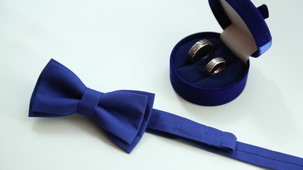 Blue bowtie and wedding rings — Stock Video