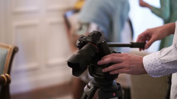 Man working with camera on tripod — Stock Video