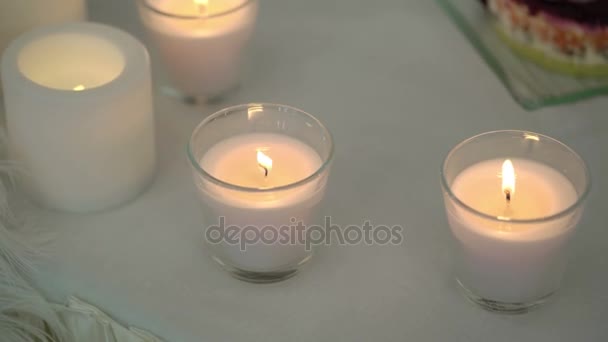 Candles on a table — Stockvideo
