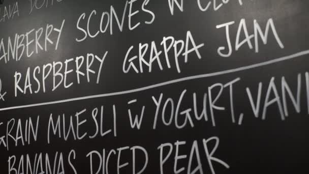 Chalk board menu in restaurant — Stock Video