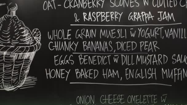 Chalk board menu in restaurant — Stock Video