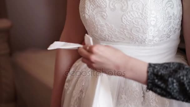 Wearing belt on wedding dress — Stock Video