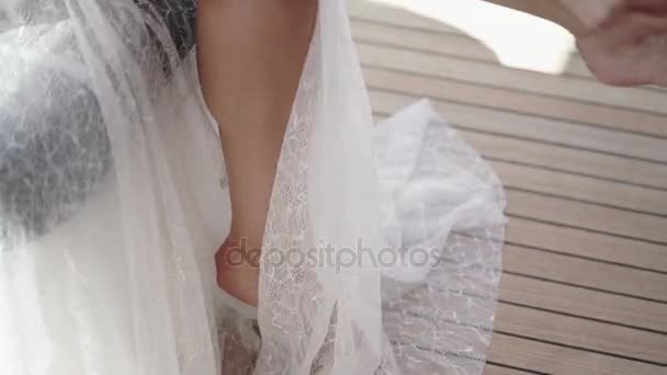 Woman in lingerie wearing garter — Stock Video