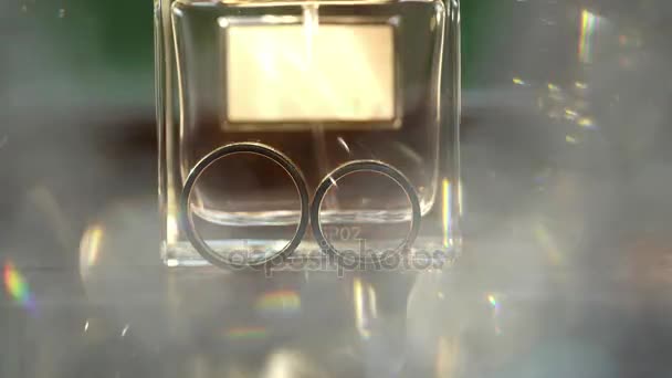 Wedding rings and perfume — Stock Video