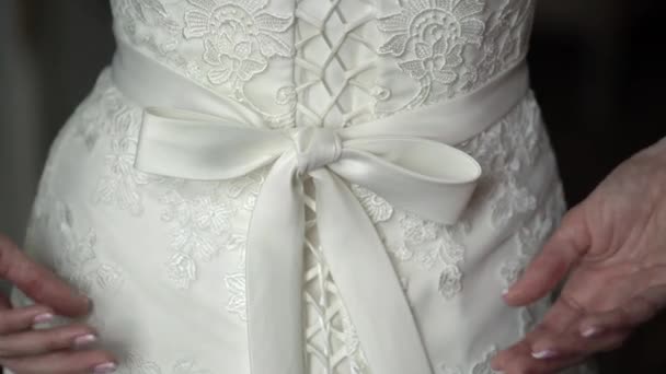 Bride touching belt at weding dress — Stock Video