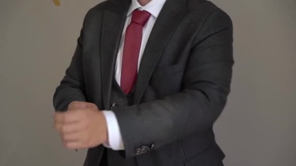 Young man put on cufflink. Dressing for celebration event, business meeting or wedding — Stock Video