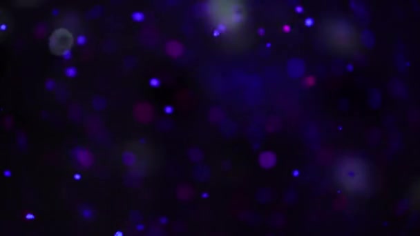 Confettis dans l'explosion de l'air ou bulles de savon à la fête. Fond abstrait flou .