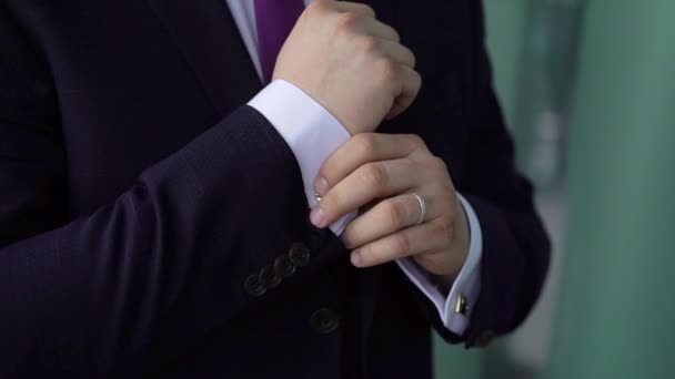 Young man put on jacket. Dressing for celebration event, business meeting or wedding — Stock Video