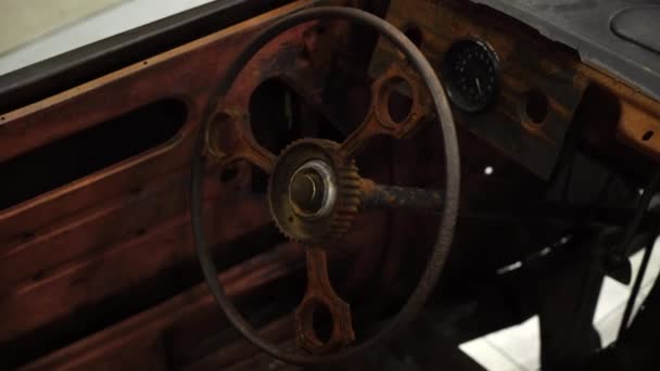 Old rusty car interior. Steering wheel and dashboard. — Stock Video
