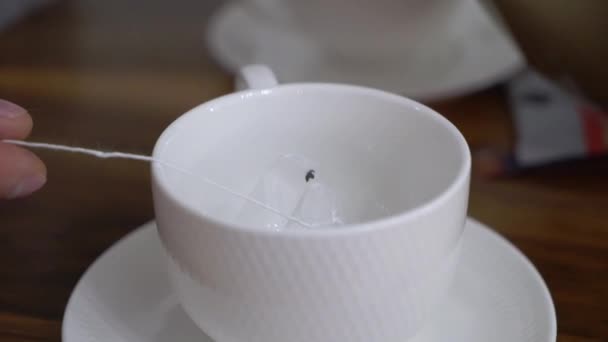 Young man drinking tea from cup in the morning. Breakfast at home — Stock Video