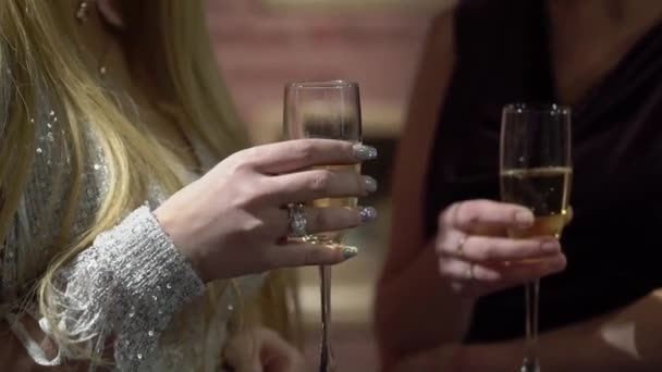 Woman with glass of sparkling wine at the party — Stock Video