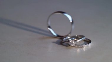 Wedding rings rolls slowmotion