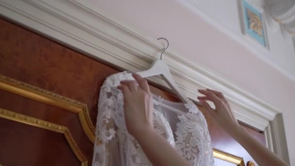 Bride getting ready in the morning. Preparation before wedding ceremony, put on dress — Stock Video