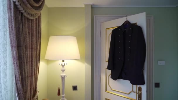 Male jacket in bedroom — Stockvideo