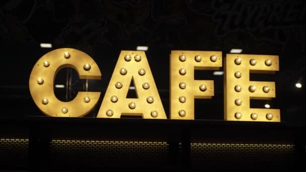 Sign Cafe letters glowing light bulbs — Stock Video