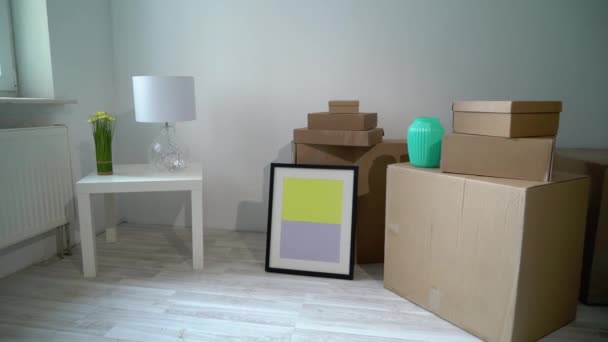 Moving or relocation to new house apartment or office. Cardboard boxes unpacking — Stock Video