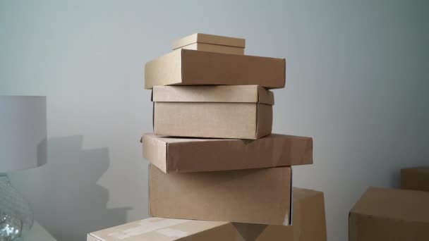 Moving or relocation to new house apartment or office. Cardboard boxes unpacking — Stock Video