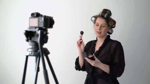 Young woman influencer blogger taking video on camera studio creating video blog — Stock Video