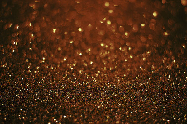 red gold background with sparkling bokeh of texture abstract