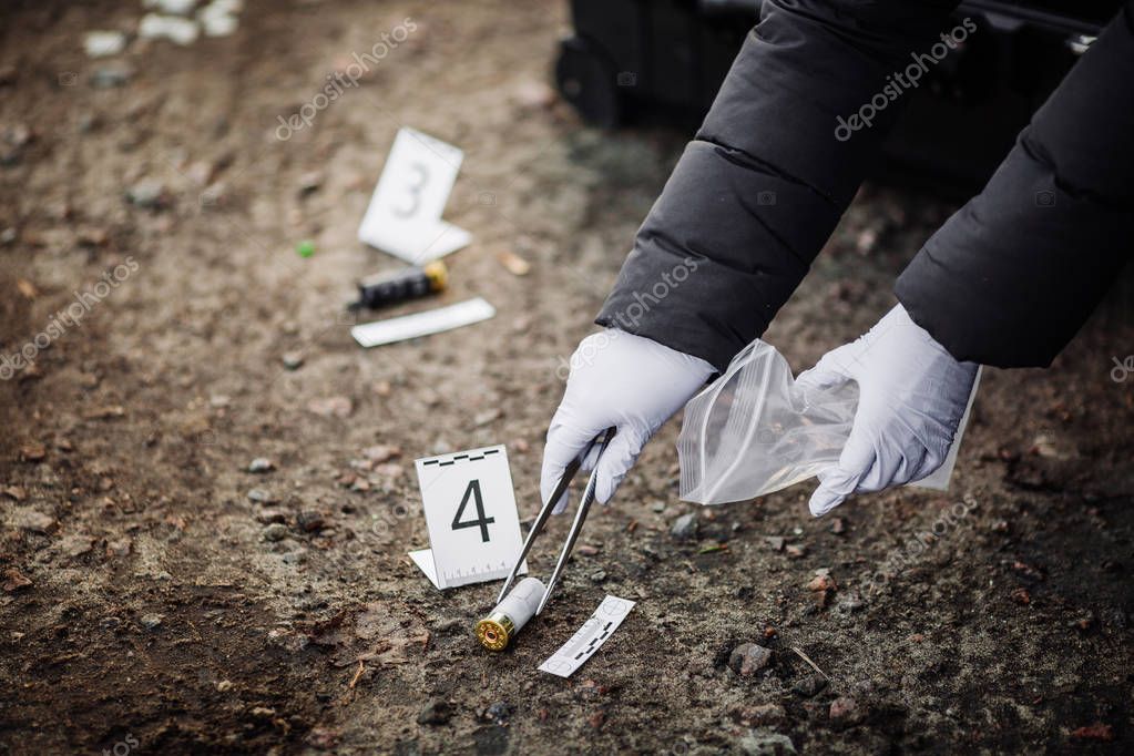 Crime scene investigation - collecting evidence Stock Photo by