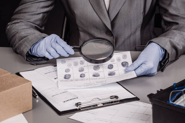 Expert with magnifying glass