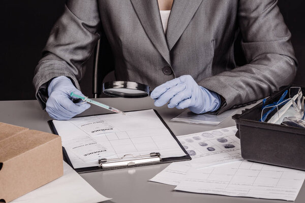 Expert with magnifying glass