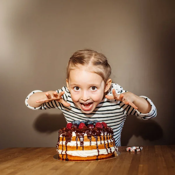 girl at birthday with cake