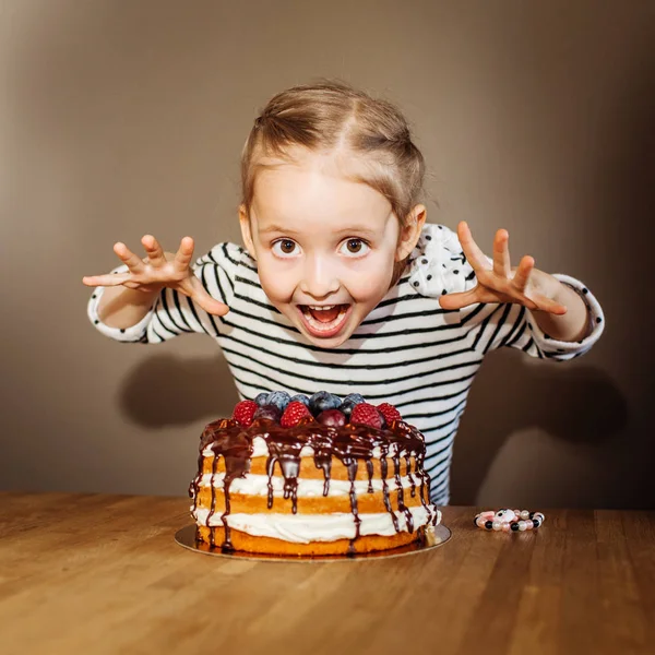 girl at birthday with cake