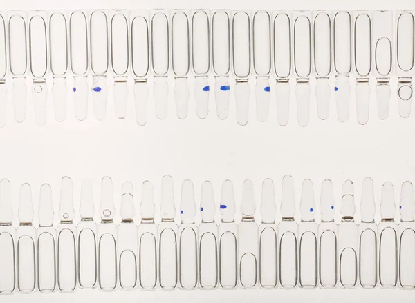 Lot of ampoules on light background — Stock Photo, Image