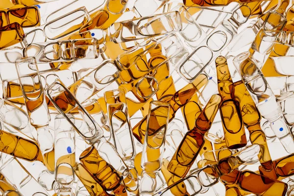 Lot of ampoules on light background — Stock Photo, Image