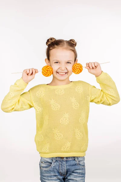 Little girl with lollipops — Stok fotoğraf