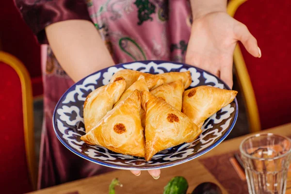 hand holding national dish