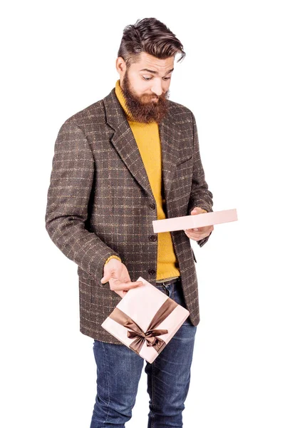 Portrait unhappy, upset man holding gift box — Stock Photo, Image