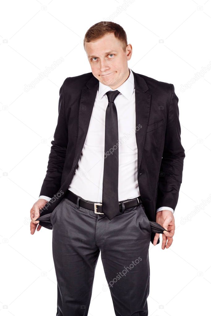 businessman showing his empty pockets isolated on white backgrou
