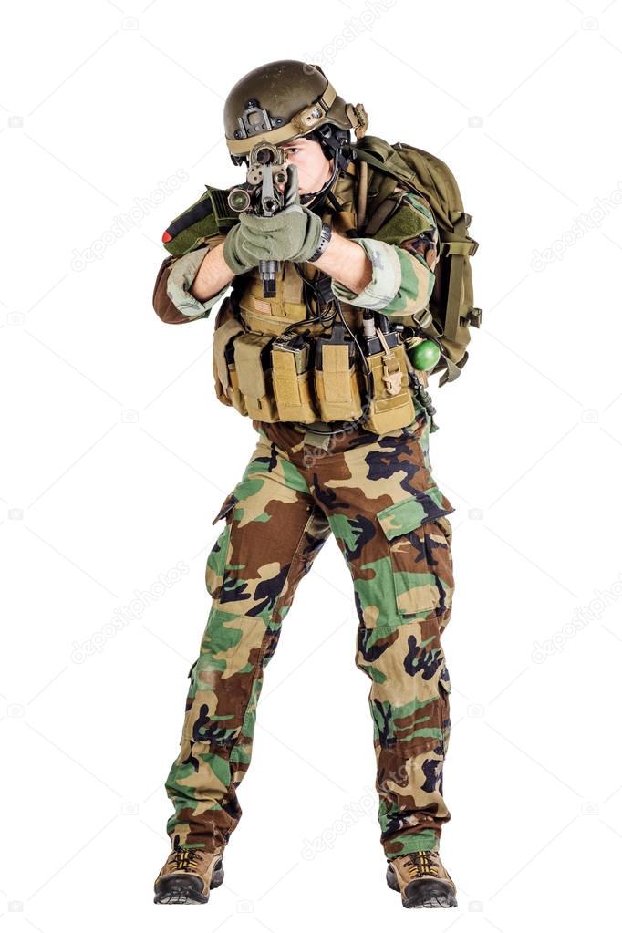 Portrait soldier or private military contractor holding sniper r