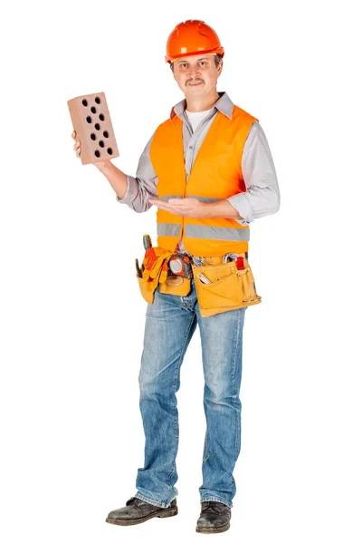 Konstruktor w kask trzyma Cegła — Zdjęcie stockowe