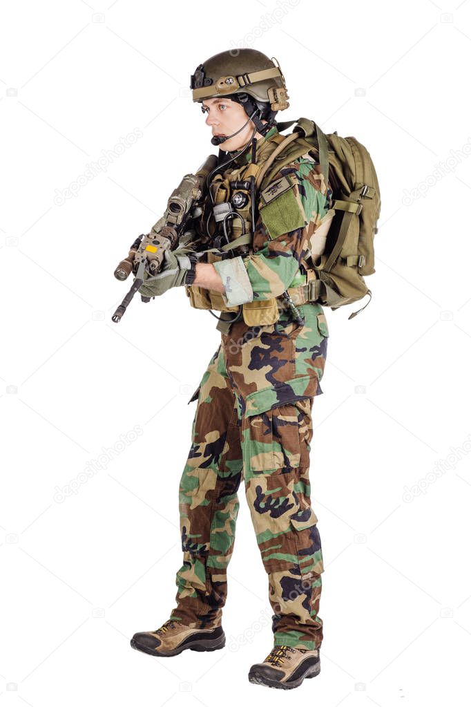 Portrait soldier or private military contractor holding sniper r