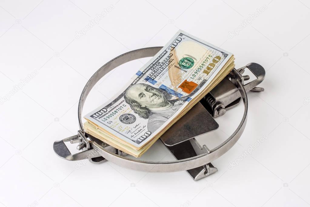 hunt trap with a bundle of dollars isolated on white. financial 