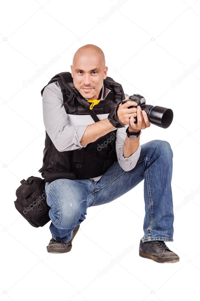 military press photographer with a professional camera. Isolated on white background