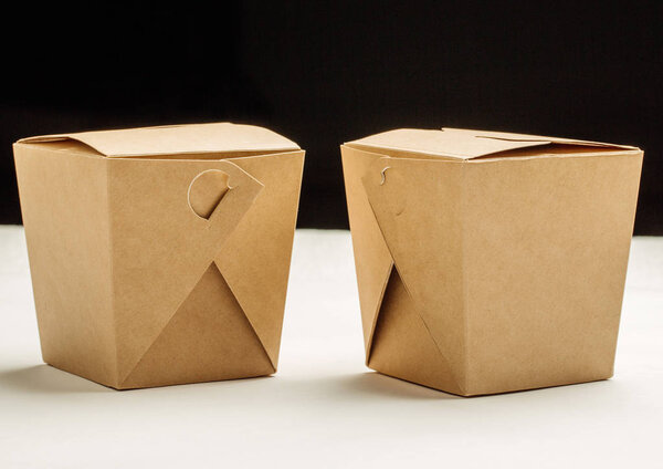 Two closed WOK paper box. Asian fast food concept.