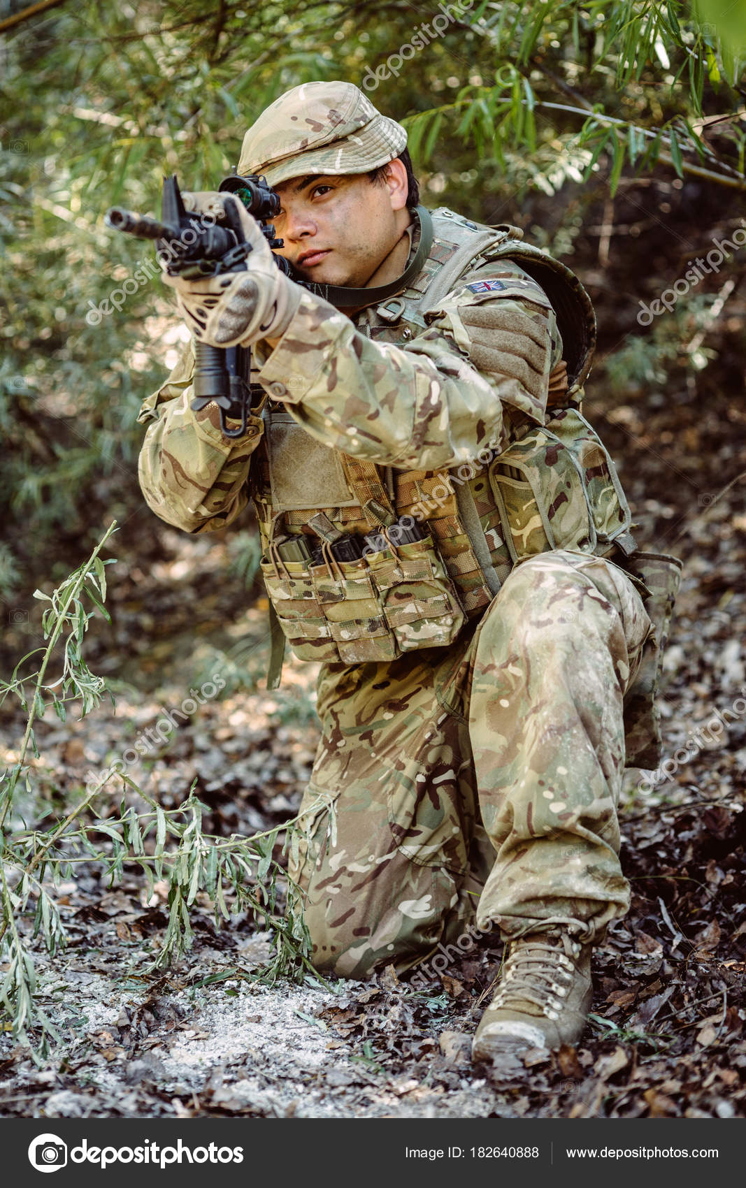 British Army sniper during the military operation in the mountain. war, army, technology and people concept. — Photo by kaninstudio