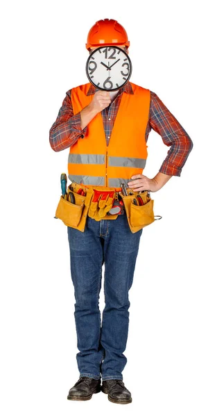 Männlicher Bauarbeiter im Helm hält große Uhr — Stockfoto