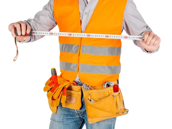 Bauarbeiter Mit Helm Und Maßband Der Hand Vor Weißem Wandhintergrund — Stockfoto