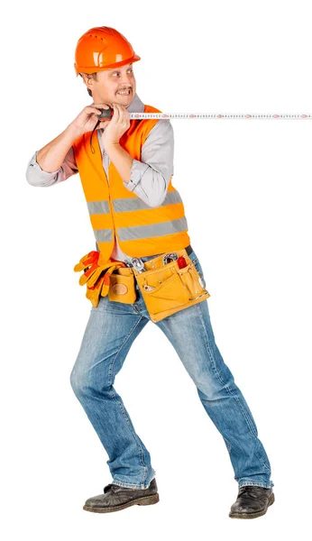 Builder Helmet Holding Tape Measure His Hands White Wall Background — Stock Photo, Image