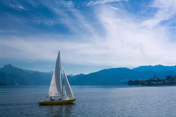 Sailboat on lake Traunsee in the mountains of the Alps, Austria Royalty Free Stock Photos
