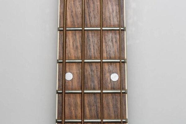 Acoustic Bass Guitar Fretboard Close Up.