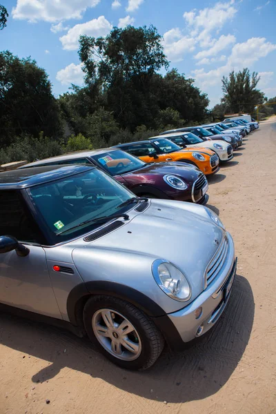 Chisinau, Moldova. July 14, 2016 : Mini Cooper club festival in Moldova. Orange MINI Cooper in dark forest on July 14, 2016 in Chisinau, Moldova. — Stock Photo, Image